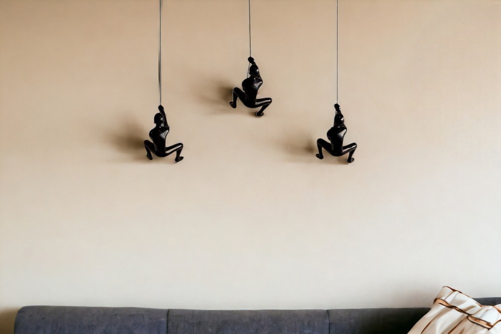 Set of Three Black Resin Climbing Man Hanging Dimensional Sculpture