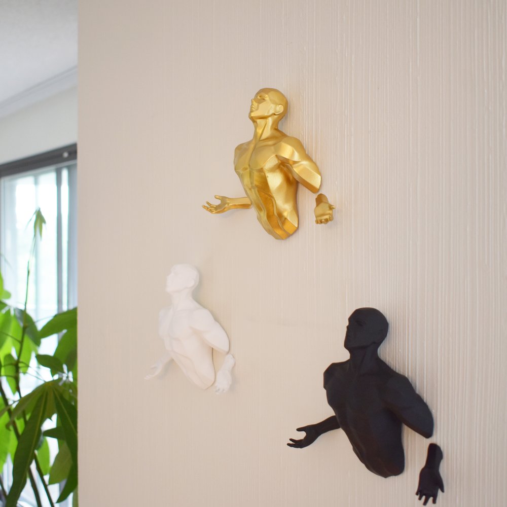 Set of Three Black Gold And White Resin Bursting Men Hanging Dimensional Sculpture