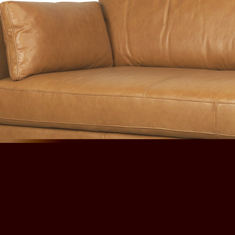 88" Tan Leather Sofa And Toss Pillows With Brown Legs